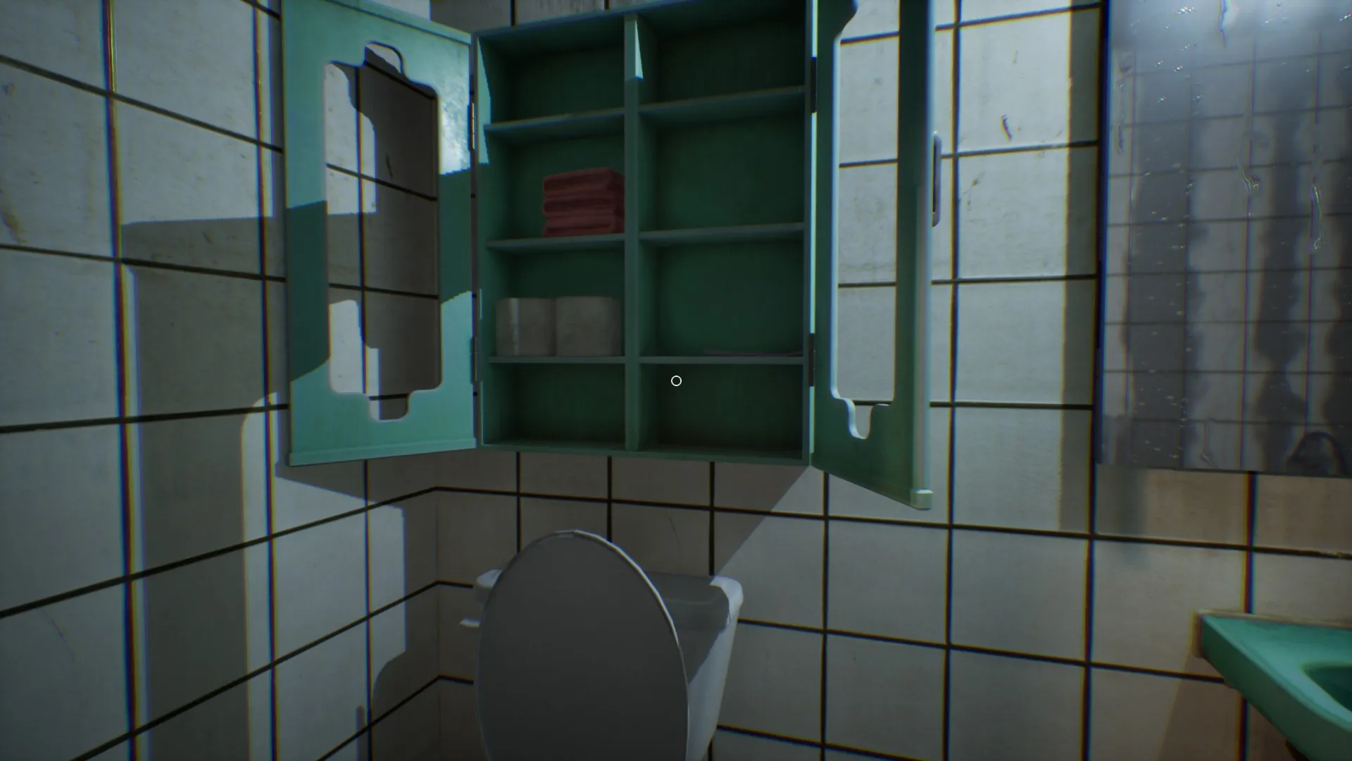 A grey baby doll lunges at the screen in a jumpscare.