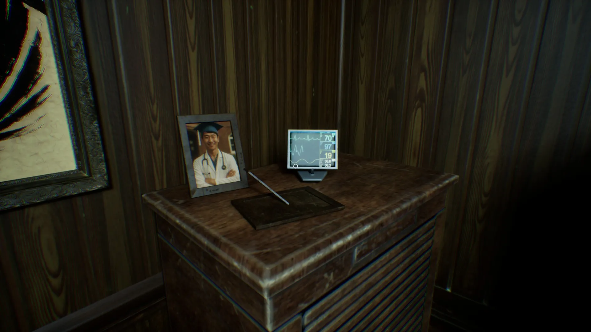 A scary face appears on the baby monitor screen.