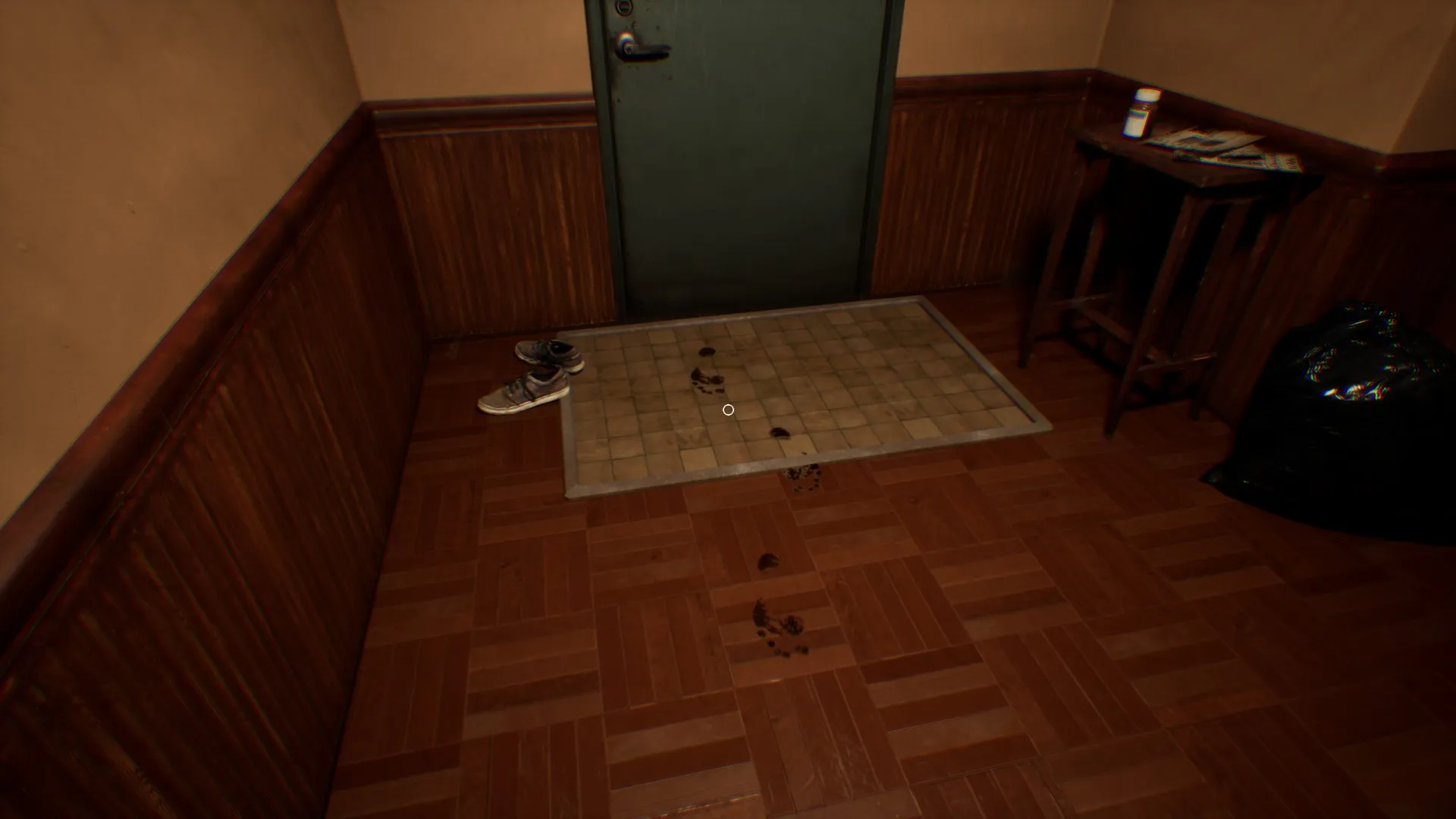 The trail of bloody footprints leads from the entryway towards the safe room.