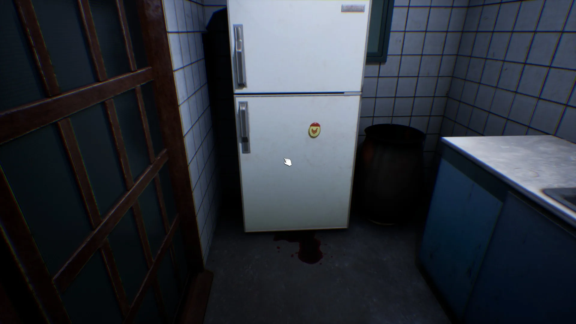 The handle of the fridge is covered in blood.