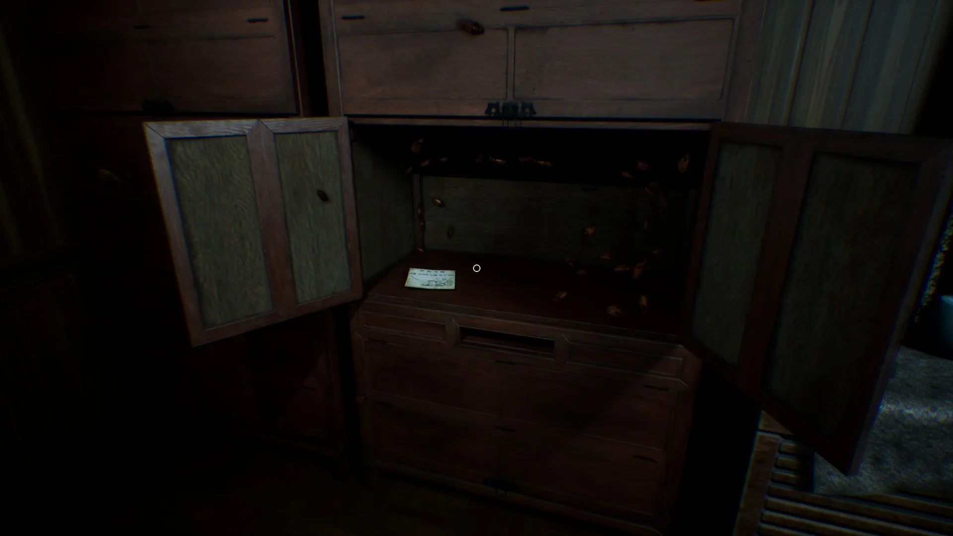 A bloody newspaper clipping on the floor.