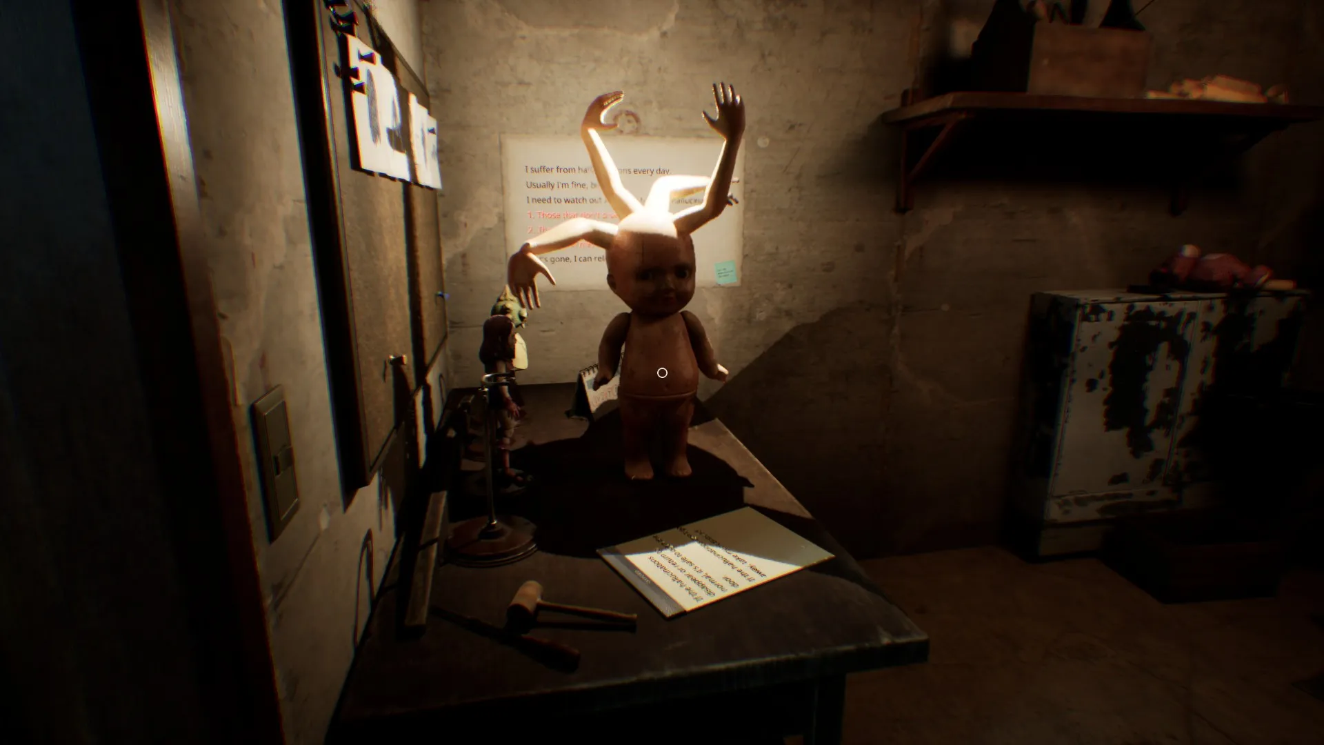 A doll waits inside the safe room at the end of the footprint trail.