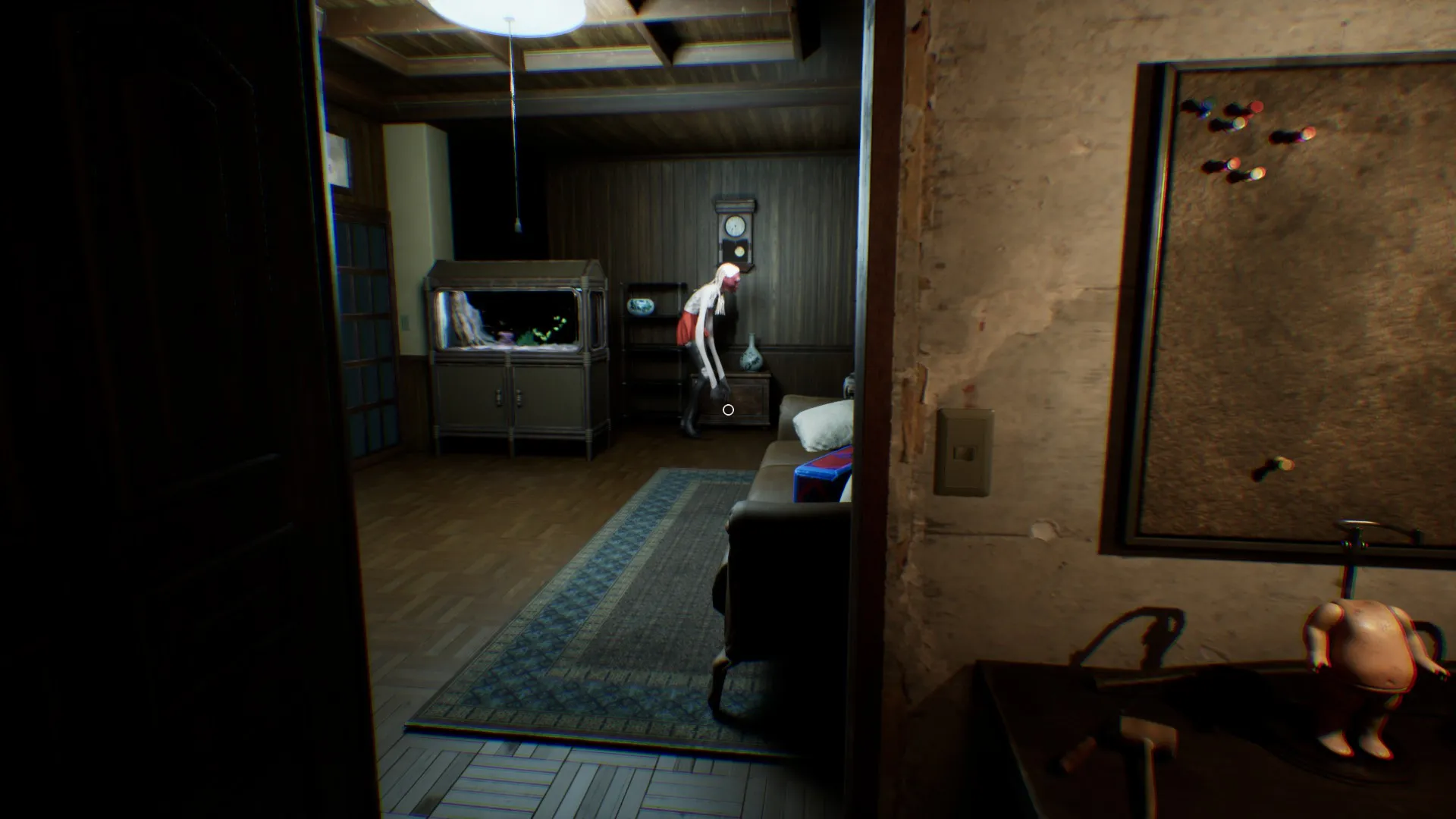 The Ghost waits for you in the living area right after you open the safe room door.