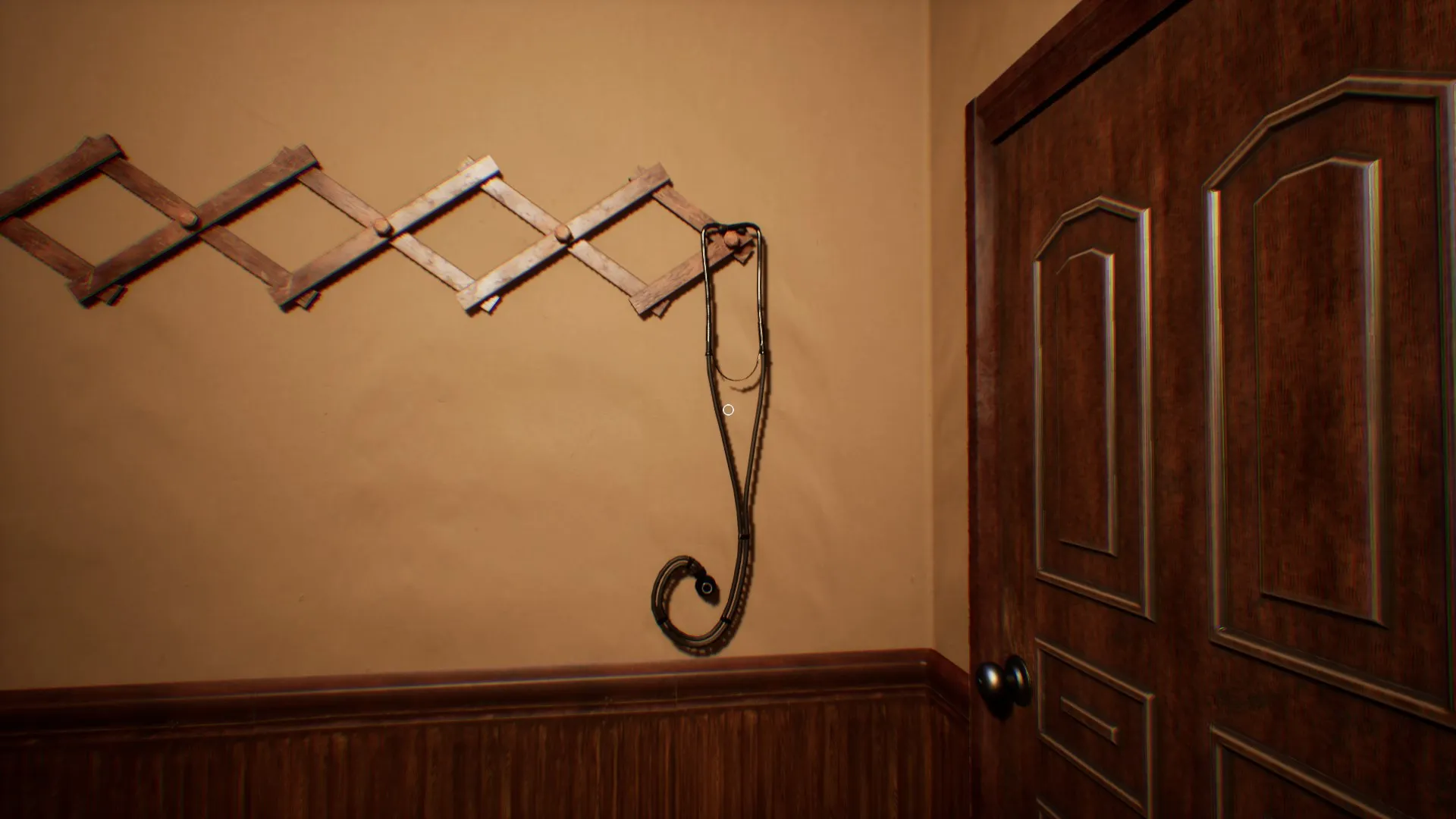 Ghostly hands are reaching out from under the front door.