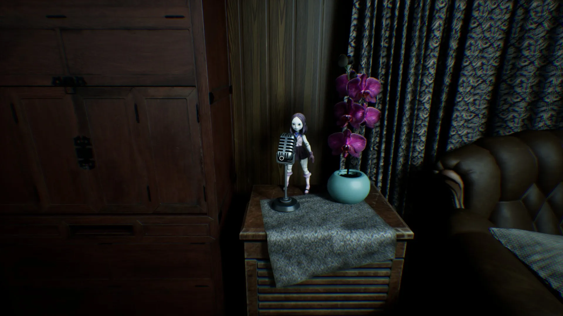 A notebook lies open on a table in the living area.