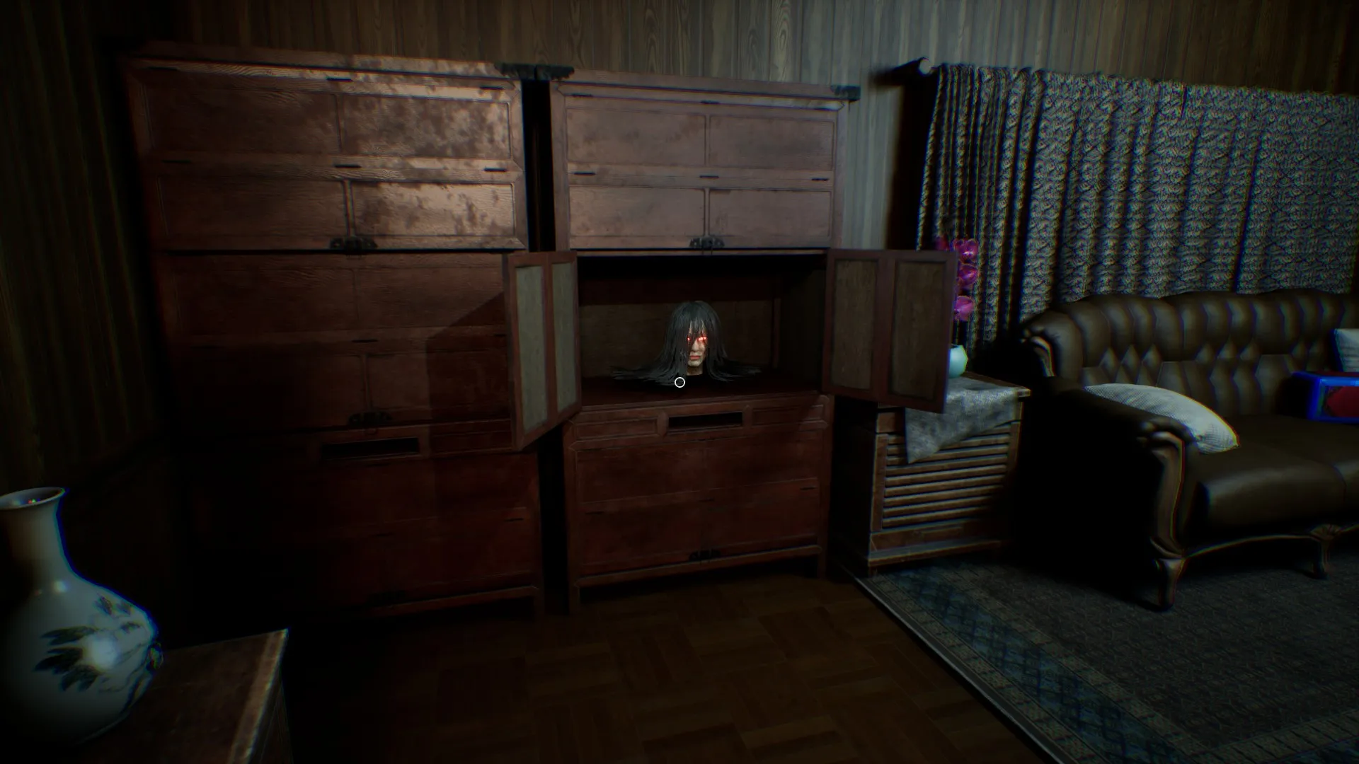 The lamp has moved to a cabinet in the living room.